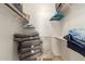 Organized closet with shelves, hangers, and neatly stored cushions, maximizing storage efficiency at 145 N 74Th St # 251, Mesa, AZ 85207