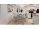 Cozy dining area featuring a glass table and ample lighting at 145 N 74Th St # 251, Mesa, AZ 85207