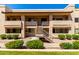 Inviting two-story condo complex featuring manicured landscaping and a charming staircase entryway at 145 N 74Th St # 251, Mesa, AZ 85207