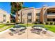 Exterior shot of the building with barbeque grills and picnic tables at 145 N 74Th St # 251, Mesa, AZ 85207