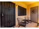 Outdoor patio featuring metal furniture and a secure entry door at 145 N 74Th St # 251, Mesa, AZ 85207