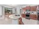 Modern kitchen with stainless appliances, granite counters, and an adjacent dining area at 17891 W Badger Way, Goodyear, AZ 85338