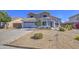Charming two-story home with xeriscaped front yard and a two car garage at 1937 W Burgess Ln, Phoenix, AZ 85041