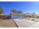 Charming home with a well-maintained exterior, desert landscaping, and an attached two-car garage at 1937 W Burgess Ln, Phoenix, AZ 85041