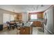 Open kitchen with stainless steel appliances and an island with seating at 1937 W Burgess Ln, Phoenix, AZ 85041