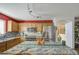 Well-lit kitchen featuring stainless steel appliances, granite countertops, and stylish backsplash at 1937 W Burgess Ln, Phoenix, AZ 85041
