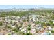 Aerial view showing houses in a green neighborhood with city skyline in the distance at 2041 N 16Th Ave, Phoenix, AZ 85007