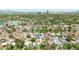 Expansive aerial view of a neighborhood, featuring tree-lined streets and community amenities like parks and tennis courts at 2041 N 16Th Ave, Phoenix, AZ 85007