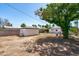 Spacious backyard with minimal landscaping and a detached garage on a sunny day at 2041 N 16Th Ave, Phoenix, AZ 85007