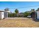 Well-sized backyard showcasing a detached garage and ample open space, ideal for various outdoor activities at 2041 N 16Th Ave, Phoenix, AZ 85007