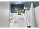 Stylish bathroom with a blue accent wall, subway tile, and decorative flooring at 2041 N 16Th Ave, Phoenix, AZ 85007