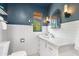 Charming bathroom with blue accent wall, subway tile, and white vanity sink at 2041 N 16Th Ave, Phoenix, AZ 85007