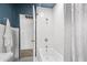 Bathroom featuring white subway tile, white shower curtain, and black and white mosaic tile flooring at 2041 N 16Th Ave, Phoenix, AZ 85007