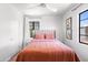 Cozy bedroom featuring a tufted headboard, bright windows, and a soothing color palette at 2041 N 16Th Ave, Phoenix, AZ 85007