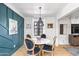 Charming dining room featuring a marble table, elegant chairs, and stylish lighting fixture at 2041 N 16Th Ave, Phoenix, AZ 85007