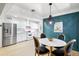 Open floor plan view of kitchen and dining area with a stylish accent wall at 2041 N 16Th Ave, Phoenix, AZ 85007