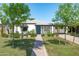 Charming single-story home featuring a vibrant front door, manicured lawn, and inviting curb appeal at 2041 N 16Th Ave, Phoenix, AZ 85007