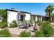 Beautiful home with a cozy patio area, lush landscaping, and a tranquil outdoor setting at 2041 N 16Th Ave, Phoenix, AZ 85007