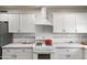 Well-lit kitchen boasting white cabinets, modern appliances, and a clean, functional design at 2041 N 16Th Ave, Phoenix, AZ 85007