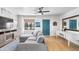 Bright living room featuring a comfortable gray couch, ceiling fan, and stylish decor at 2041 N 16Th Ave, Phoenix, AZ 85007