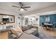 Open-concept living room with a gray couch, view into the kitchen and dining areas at 2041 N 16Th Ave, Phoenix, AZ 85007