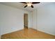Cozy bedroom with vinyl flooring, closet with sliding doors, and ample natural light at 218 E Milada Dr, Phoenix, AZ 85042