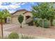 Charming single-story home featuring desert landscaping and a tile roof at 218 E Milada Dr, Phoenix, AZ 85042