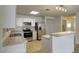 Bright kitchen features stainless steel appliances and white cabinetry at 218 E Milada Dr, Phoenix, AZ 85042