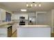 Bright kitchen features stainless steel appliances and white cabinetry at 218 E Milada Dr, Phoenix, AZ 85042