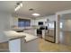 Bright kitchen featuring stainless steel appliances and granite countertops at 218 E Milada Dr, Phoenix, AZ 85042