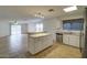 Bright kitchen features granite countertops, stainless appliances, and an island with additional storage at 218 E Milada Dr, Phoenix, AZ 85042