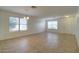 Inviting living room with tile flooring, neutral walls, and lots of natural light at 218 E Milada Dr, Phoenix, AZ 85042