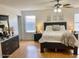 Spacious main bedroom with a ceiling fan and natural light from the window at 218 E Milada Dr, Phoenix, AZ 85042