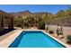 Backyard swimming pool surrounded by desert landscaping and mountain views at 23516 N 119Th Way, Scottsdale, AZ 85255