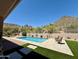 Backyard swimming pool with desert landscaping, patio, and mountain views at 23516 N 119Th Way, Scottsdale, AZ 85255