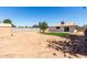Backyard featuring a freshly landscaped grass patch and a utility shed at 2443 E Randall Dr, Tempe, AZ 85288