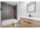 Bathroom featuring tiled shower, modern sink, and vanity at 2443 E Randall Dr, Tempe, AZ 85288