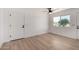 Neutral bedroom featuring modern finishes, sleek ceiling fan, and hardwood flooring at 2443 E Randall Dr, Tempe, AZ 85288
