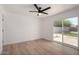 Bright bedroom with sliding glass doors and a ceiling fan at 2443 E Randall Dr, Tempe, AZ 85288