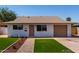 Inviting single-story home with a well-kept front yard and neutral color palette at 2443 E Randall Dr, Tempe, AZ 85288