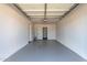 Spacious two-car garage with freshly painted walls and floor at 2443 E Randall Dr, Tempe, AZ 85288