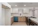 Updated kitchen with white cabinets, stainless steel appliances, and a spacious island at 2443 E Randall Dr, Tempe, AZ 85288
