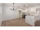 Renovated kitchen featuring new appliances, stone countertops, and tiled backsplash at 2443 E Randall Dr, Tempe, AZ 85288