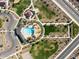 Aerial view of a community pool, shaded picnic areas, parking and green spaces at 2519 E Fortana Dr, San Tan Valley, AZ 85143