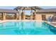 Community pool with covered pavilion, stone pillars and accessible chair lift at 2519 E Fortana Dr, San Tan Valley, AZ 85143