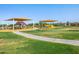 Community park featuring playgrounds, picnic areas, and lush green spaces, providing a vibrant recreational environment at 2519 E Fortana Dr, San Tan Valley, AZ 85143