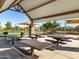 Inside a picnic pavilion featuring multiple tables and views of a playground, ideal for outdoor events at 2519 E Fortana Dr, San Tan Valley, AZ 85143