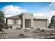 Contemporary single-story home showcasing desert landscaping and a neutral color palette at 25801 N 147Th Dr, Surprise, AZ 85387