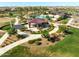 Elevated view showcases a community pavilion, walking paths, landscaping, and green spaces for residents to relish at 2588 E Grenache Rd, San Tan Valley, AZ 85143