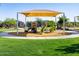 Community playground with slides, climbing structures, and protective ground cover at 2591 E Fortana Dr, San Tan Valley, AZ 85143